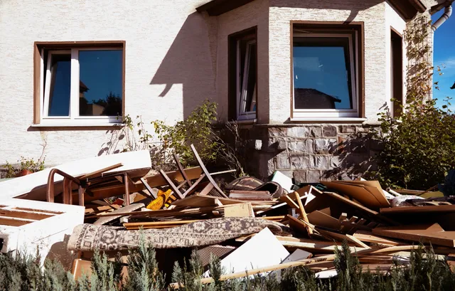 A house that has been demolished and is being torn down.